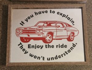 A red car with the words " if you have to explain, enjoy the ride they won 't understand ".